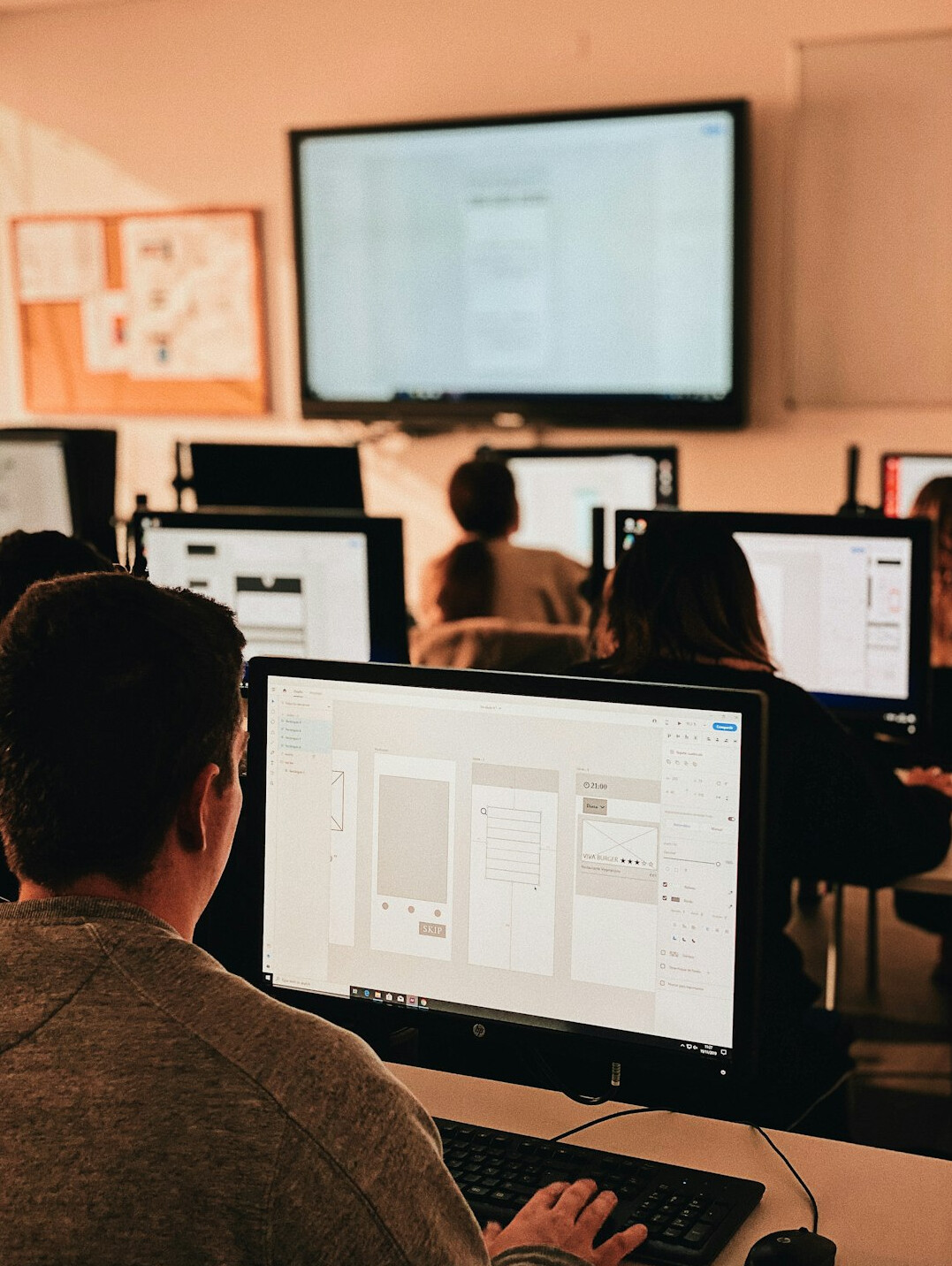 man teaching coding class